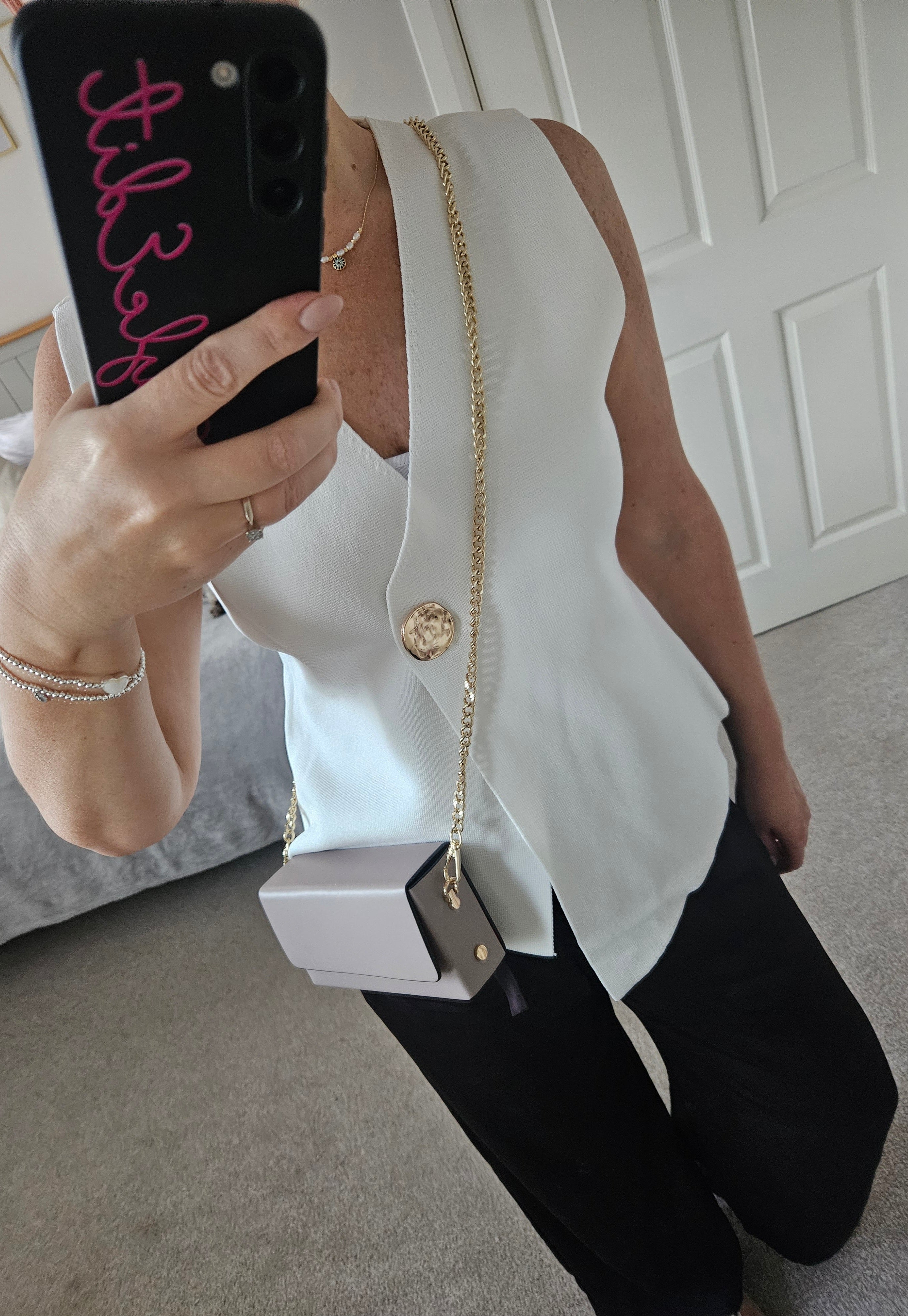 Clementine sleeveless knit with gold button - White