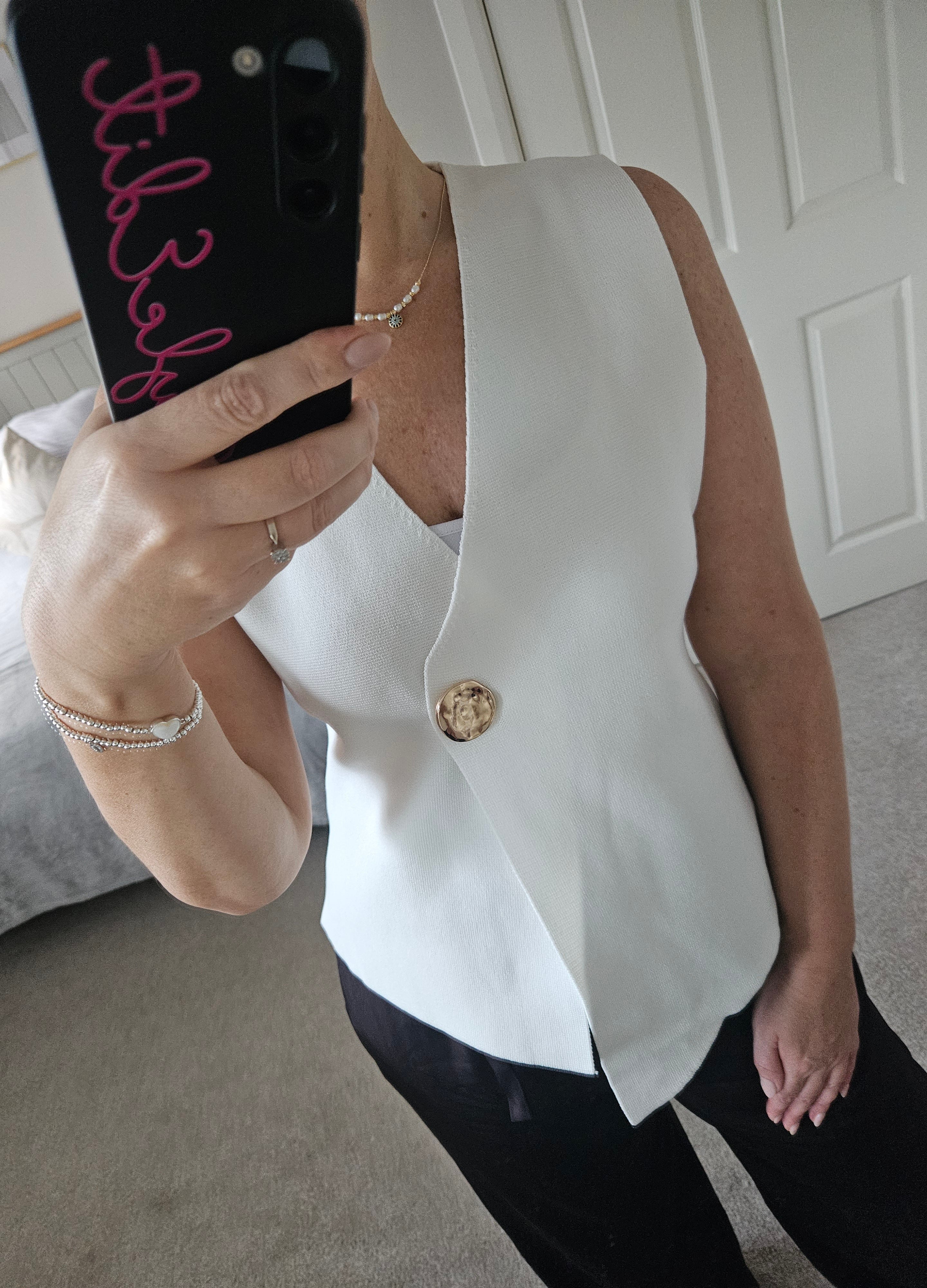 Clementine sleeveless knit with gold button - White